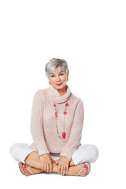 istock Happy Senior Woman Sitting On Floor 182036603