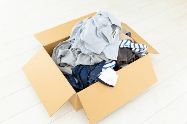 istock Clothing packed in a cardboard box. 1820378788
