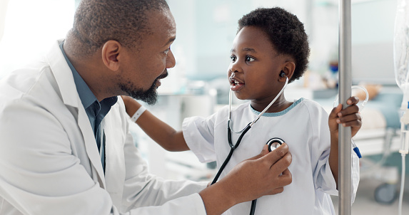 Doctor, patient and child with stethoscope, hospital and check up for health, breathing and illness. Smile, playing and pediatrician for wellness, medical and asthma for heart, healthcare or medicine