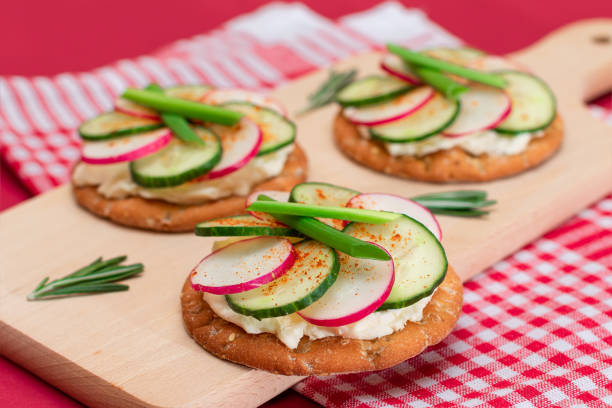 istock Cracker Sandwich with Cream Cheese, Fresh Cucumber and Radish 1820389151