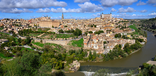 City skyline of Toledo under cloudy blue sky