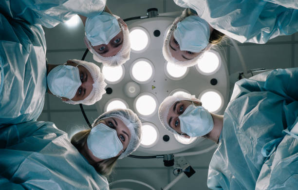 istock Doctors look at a patient who is lying on the operating table. 1820420473