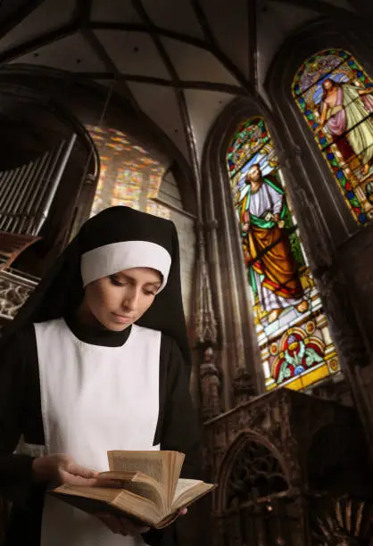 Young Nun Reading Bible in the Catholic ChurchSEE more of this girl:
