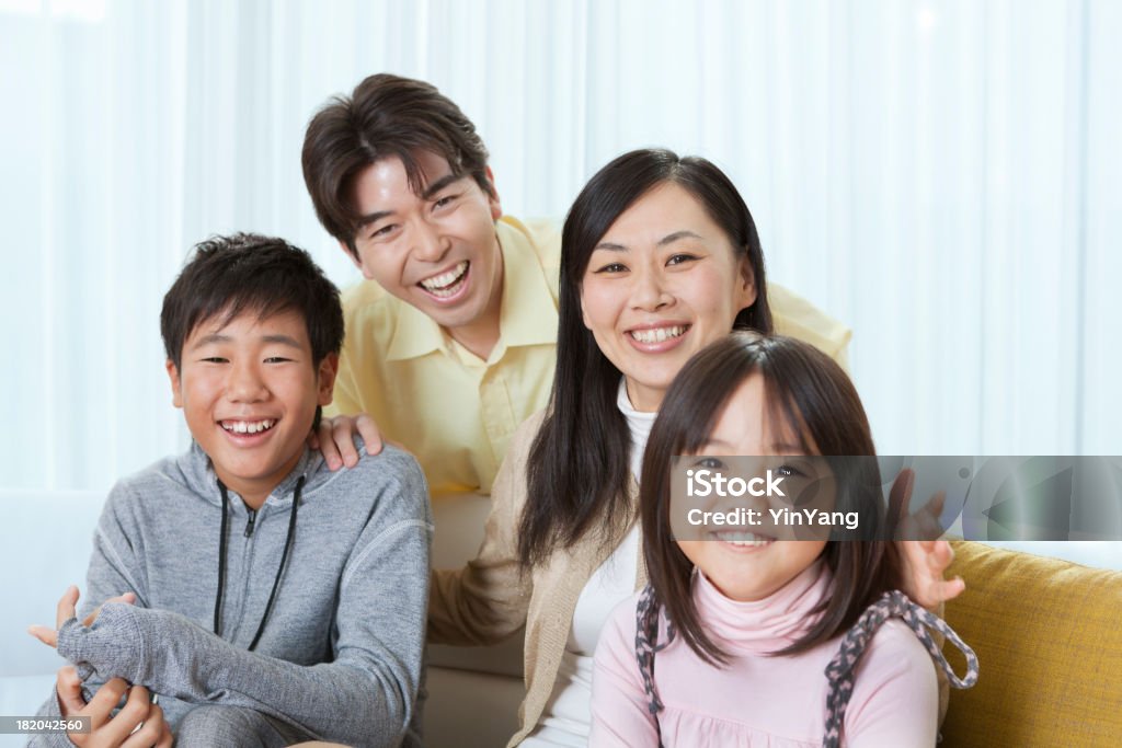 Portrait of Young Japanese Family in Their Home Interior "Subject: Head and shoulder portrait of a young Japanese family in their home.Location: Tokyo, Japan." 30-39 Years Stock Photo