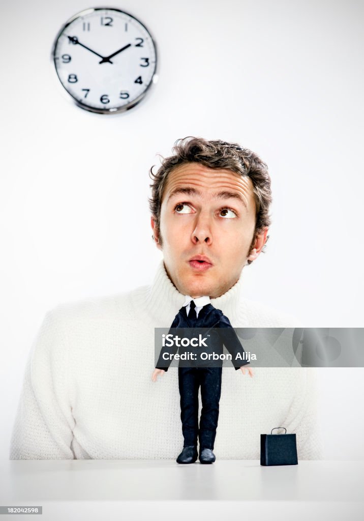 Mini business man Portrait of a man with miniature body worried about time. Hand made body. Adult Stock Photo