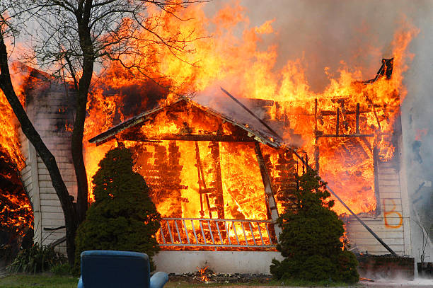 istock House burning out of control, totally destroyed 182042650