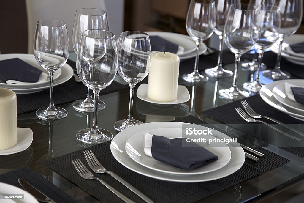 Elegant table Elegant table with glass and silverware. Candle Stock Photo