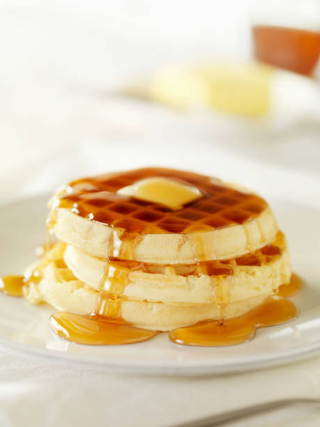 waffles with maple syrup - stroopwafel stockfoto's en -beelden