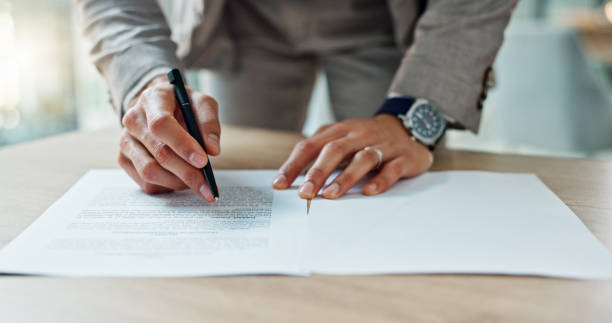 istock Business, hands and writing signature on contract or legal documents for application or agreement in office. Pen, closeup and person reading paperwork, work policy or form in workplace or company 1820432509