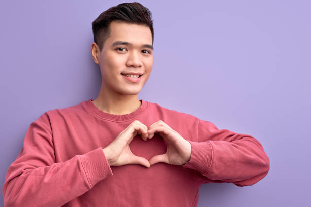 istock portrait of asian guy expressing love at camera 1820433035