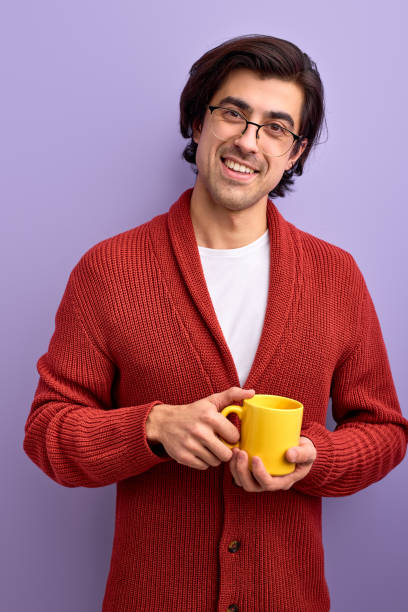 istock Young handsome smiling man drinking tea in morning, enjoy life 1820433051