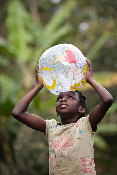 istock African girl is holding world 182043504