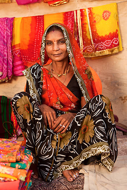 istock Woman selling colorful fabrics 182043847