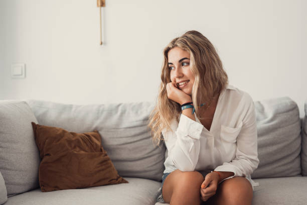 istock Happy young woman look in distance feeling positive and optimistic, dream or visualizing of new beginning, smiling millennial girl thinking overjoyed excited for future, happiness, good mood concept 1820457100