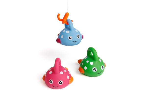 istock Funny toy children's colorful fish, one caught a hook 1820476957