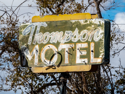 Thompson, Utah, USA-November 8, 2023: Old neon sign for an a long abandoned motel in Thompson, Utah.