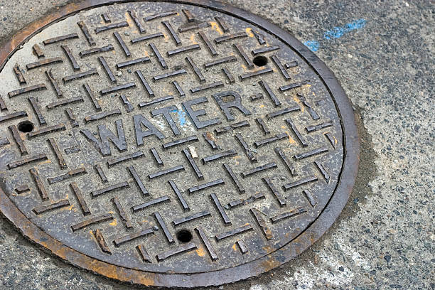 Water Manhole cover Water manhole cover in the street manhole stock pictures, royalty-free photos & images