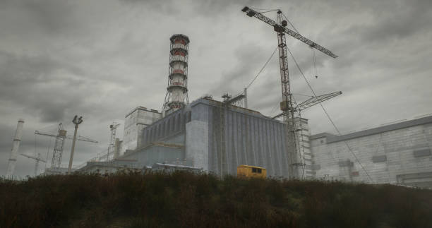 Digitally generated Chornobyl NPP (the original/old sarcophagus covering the destroyed reactor no. 4) on a dark and cloudy day.The scene was created in Autodesk® 3ds Max 2024 with V-Ray 6 and rendered with photorealistic shaders and lighting in Chaos® Vantage with some post-production added.