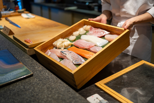 typical Japanese food in decorated and colorful dishes, Sushi and Sashimi.