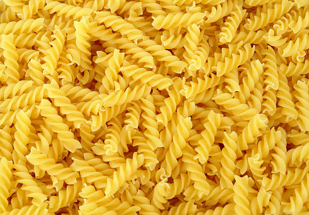 istock Close-up overhead view of yellow pasta 182050673
