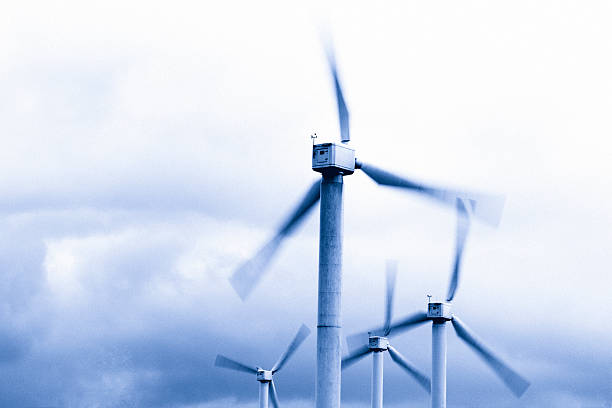 Wind Power Toned image of wind turbines. floating electric generator stock pictures, royalty-free photos & images