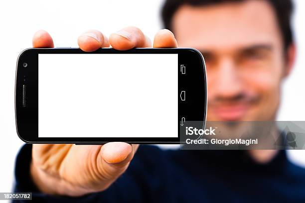 Foto de Homem Sorridente Com O Smartphone Com Tela Em Branco Grande e mais fotos de stock de Adulto