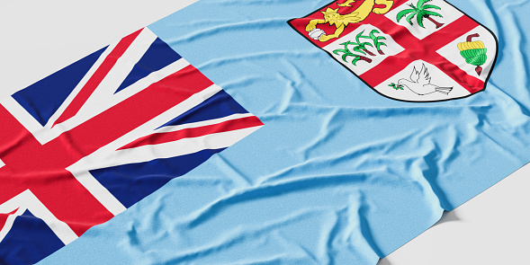 Flag of Fiji. Fabric textured Fiji flag isolated on white background