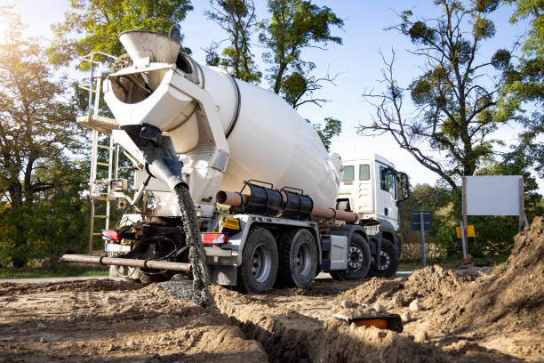 istock Concrete Mixer Truck Pouring Concrete on a Construction Site 1820522085