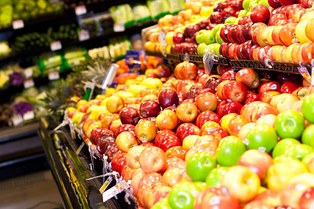 istock Produce aisle with apples at the grocery store 182052447