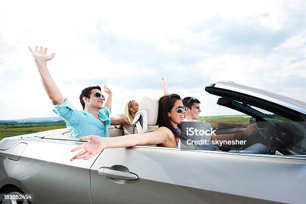 Young Couples Driving In A Cabriolet Stock Photo - Download Image Now - Convertible, Friendship, Driving