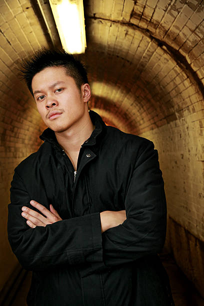 Serious Young Man young man (twenty) looking serious in a tunnel modelkt stock pictures, royalty-free photos & images