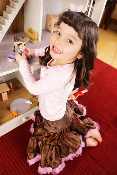 istock Little Girl with Dollhouse 182052723