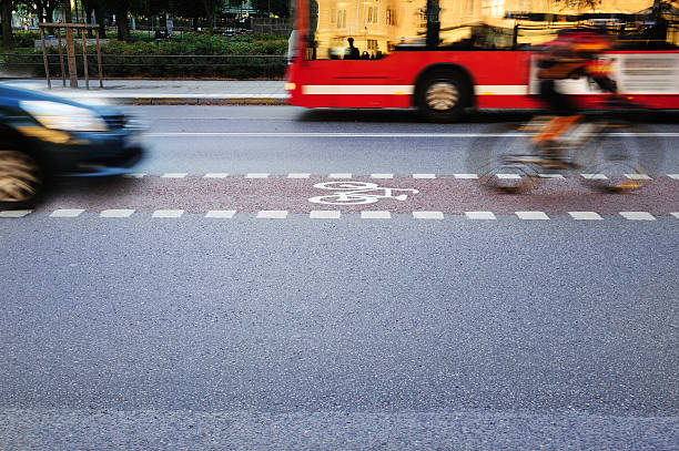 istock Bicyclist in bike lane 182052728