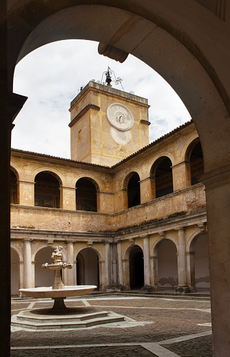 A view of the cloister of Certosa di San Lorenzo at Padula, an ancient Carthusian monastery, founded in 1306 in Campania (Italy). This monastery, the biggest of Italy, was declared Unesco World Heritage in 1998