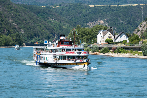 Recreational vessel touring with tourists on the river Rhine near Koblenz in Germany.