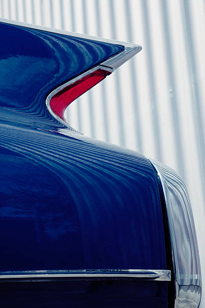 Classic American Car Tail Fin Against Corrugated Iron Metal Wall