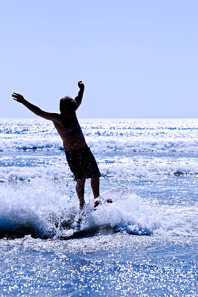 istock Silhouette of a skim boarder 182053460