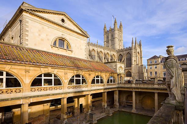 istock Roman Baths and the Bath Abbey in Bath England Somerset 182053554