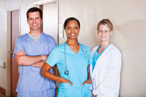 istock Medical workers standing in hospital corridor 182053582