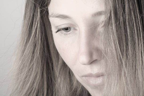 istock Beautiful woman thinking, toned 182053750