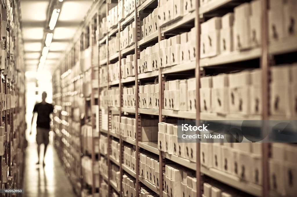 searching files in a archive man searching files in a archive Archives Stock Photo