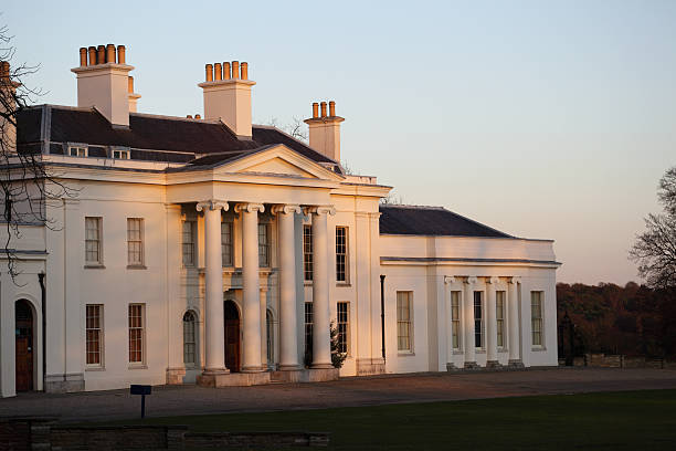 istock evening winter sun on neo-classical manor house 182054017