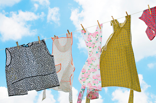 Colorful laundry hanging on a clothesline at angle against a beautiful sky.