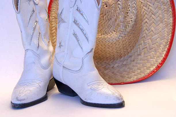 cowboy boots and hat stock photo