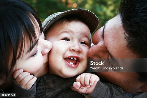 Parents Kissing Child Stock Photo - Download Image Now - Indigenous Peoples of the Americas, Family, Child