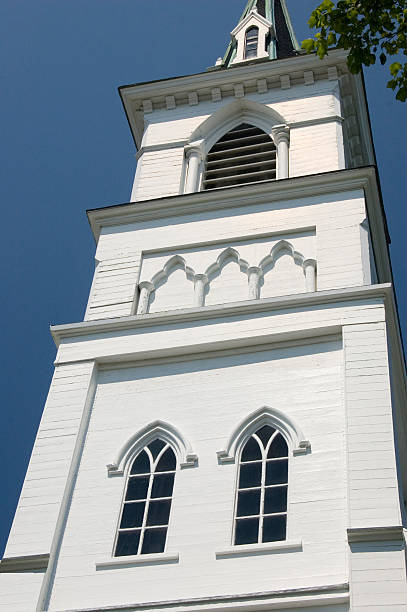 istock New England church steeple on a sunny day. 182055012