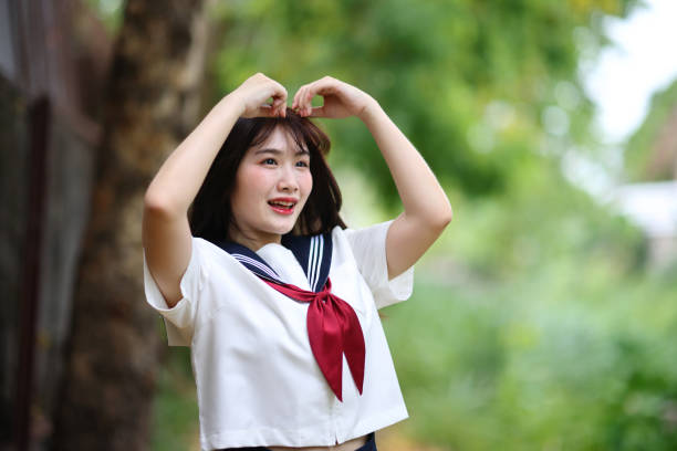 istock Japanese high school student looking in park with tree background 1820550808