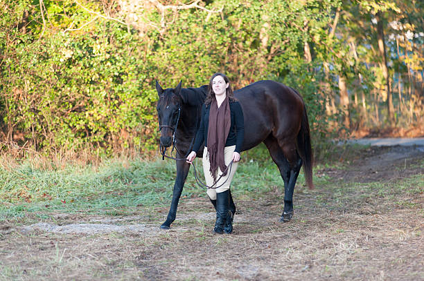istock Girl Riding Purebred Horse 182055100