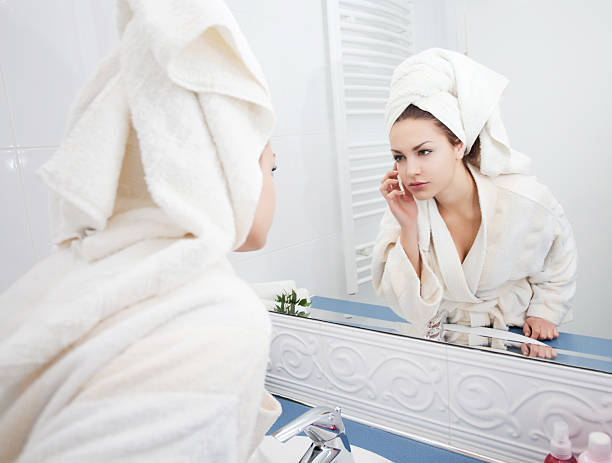 istock Attractive young woman looking at mirror. 182055129