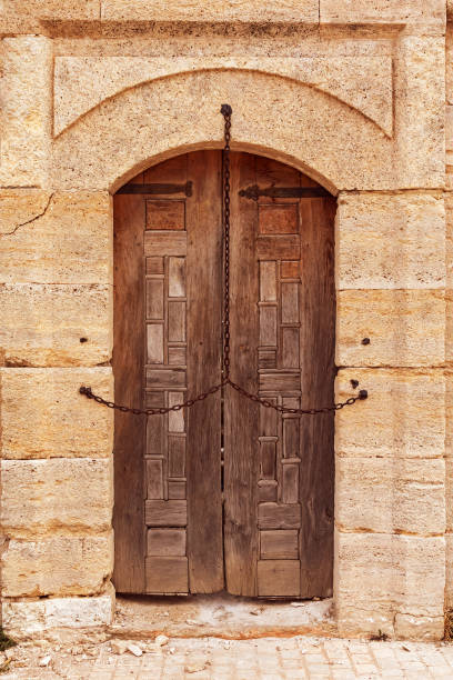 istock Ancient wooden door with chain 1820552435